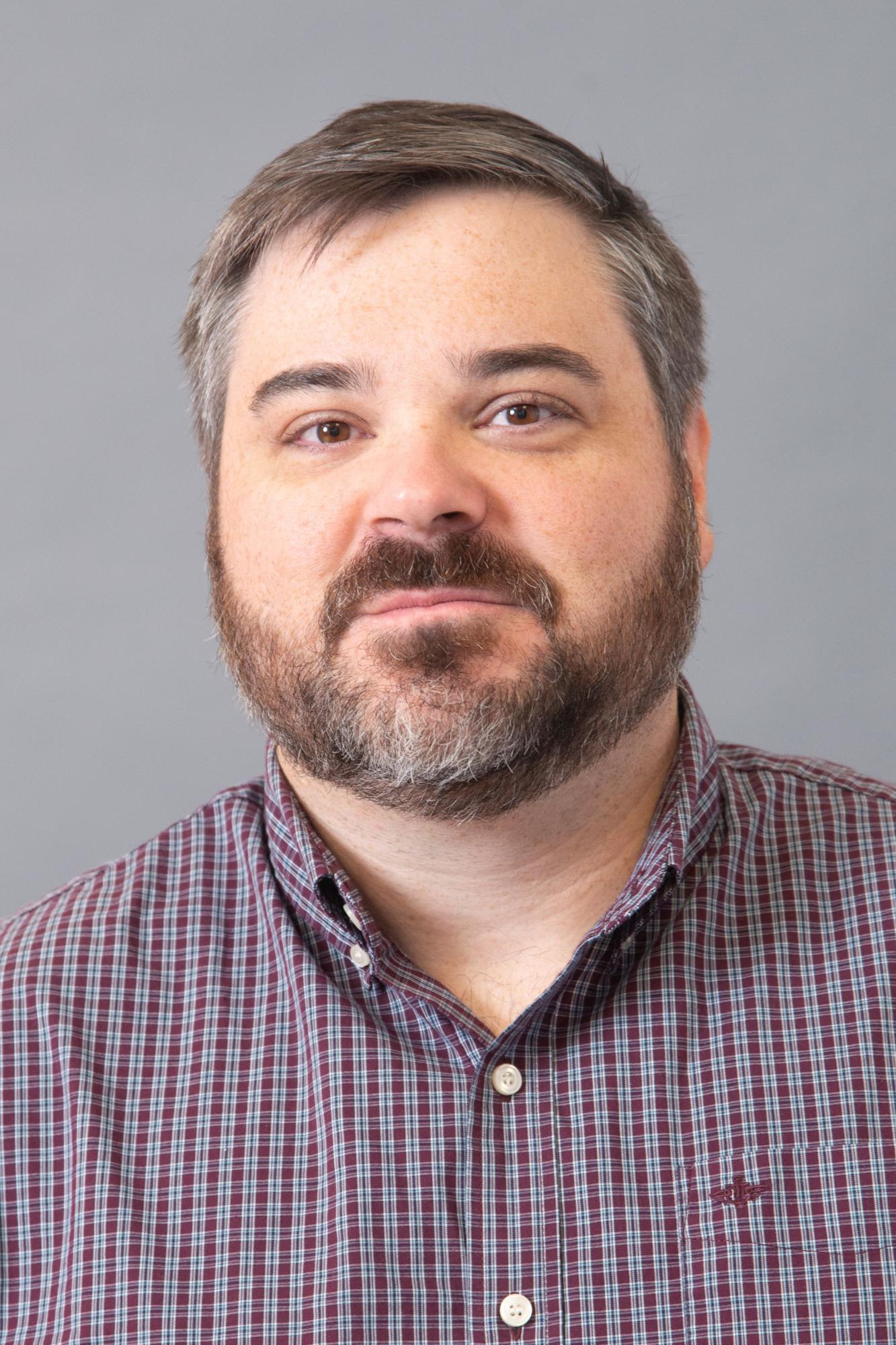 Man smiling with beard 