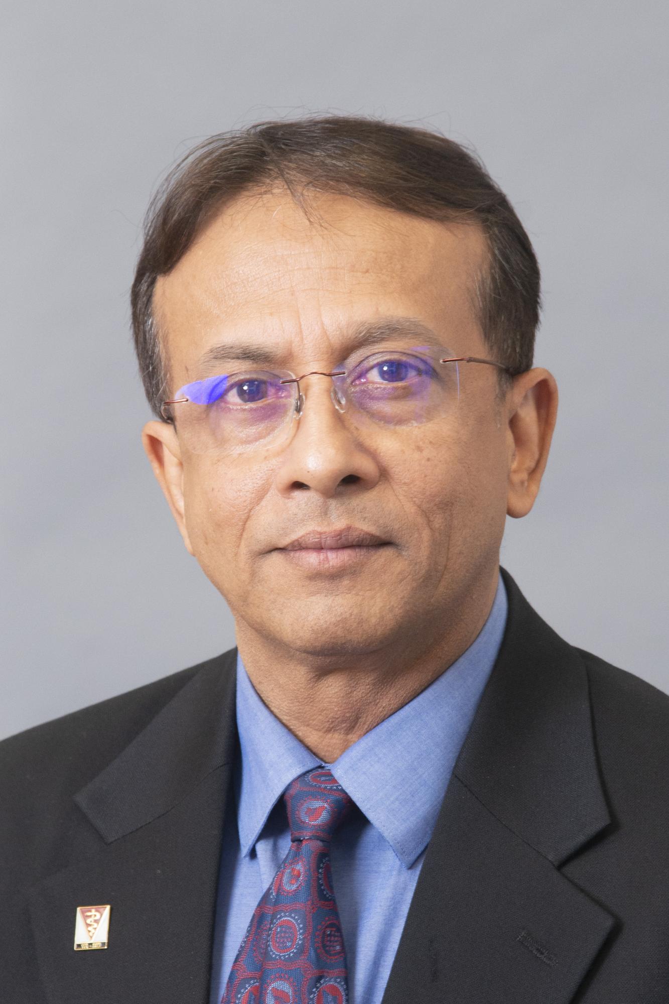Man smiling with glasses